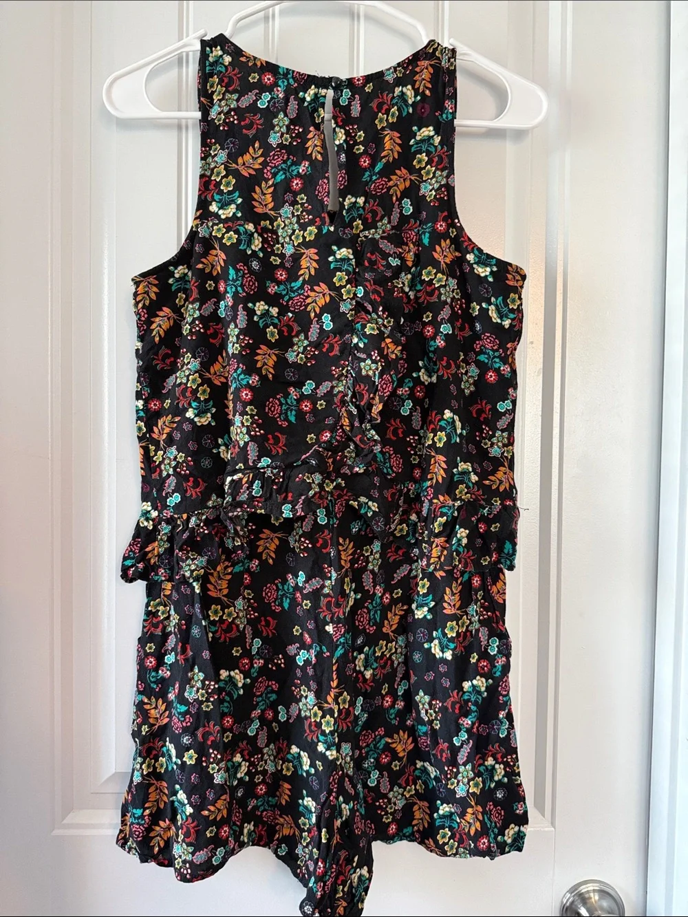 Gently worn Black Floral Ruffled Waist Sleeveless Romper